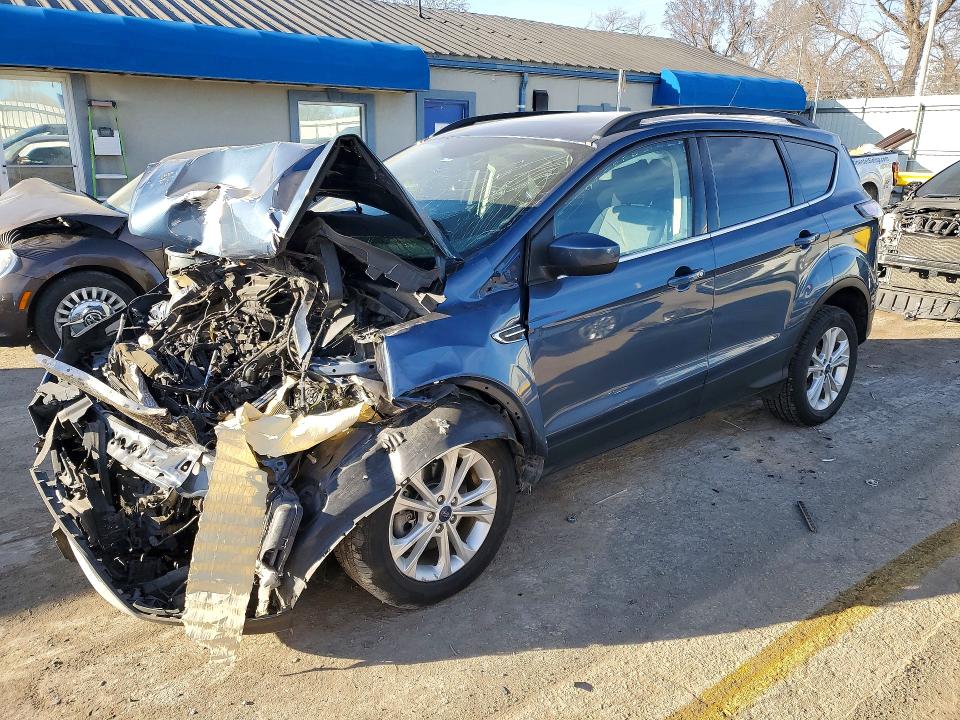 FORD ESCAPE 2018 with VIN 1FMCU9GD0JUC56014 - Photo from auction