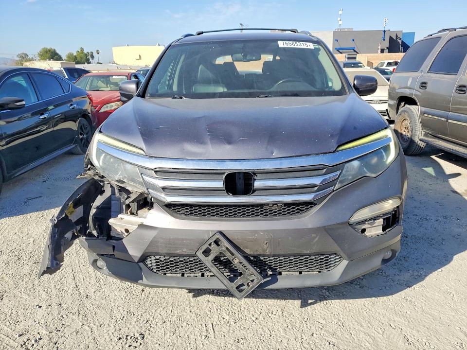 Photo 5 from auction – 2016 HONDA PILOT with VIN 5FNYF5H54GB054623