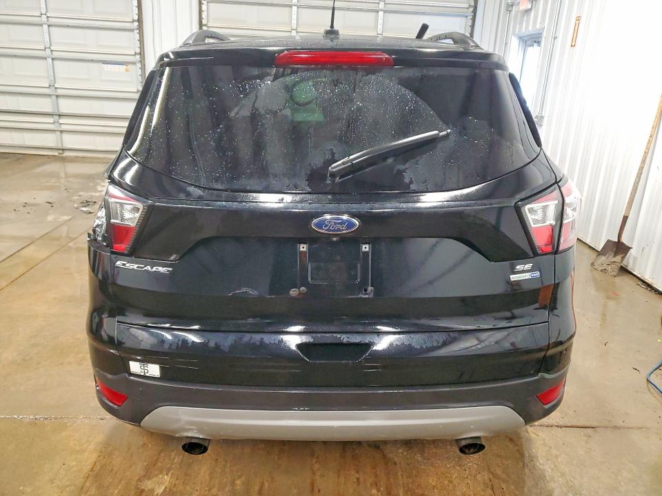 Photo 6 from auction – 2018 FORD ESCAPE with VIN 1FMCU9GD9JUA77454