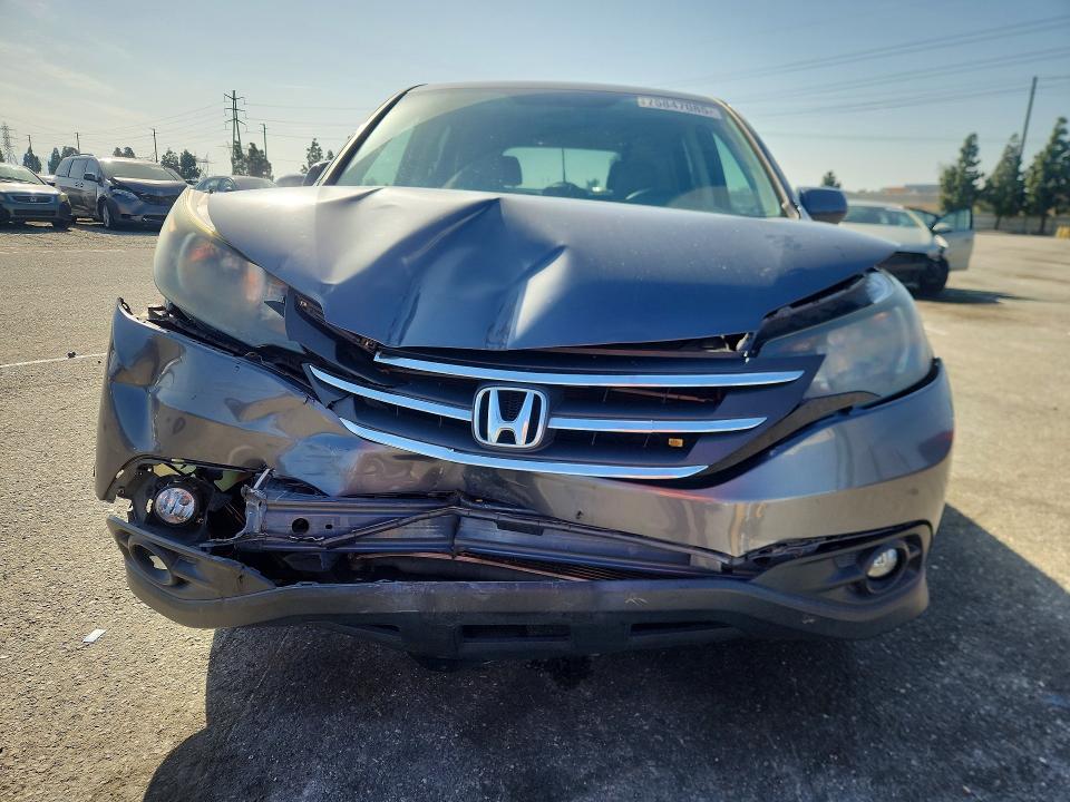 Photo 5 from auction – 2014 HONDA CR-V with VIN 3CZRM3H59EG705731