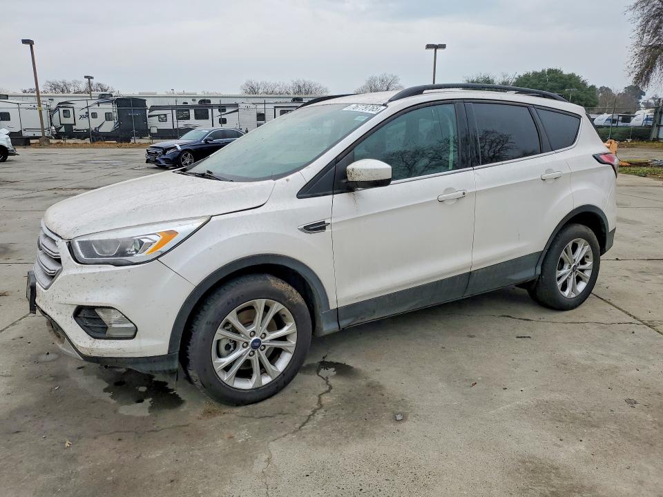 FORD ESCAPE 2018 with VIN 1FMCU9HD4JUC09812 - Photo from auction