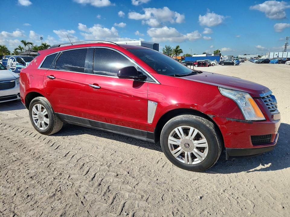 Foto 4 de la subasta – 2014 CADILLAC SRX con VIN 3GYFNAE30ES658433