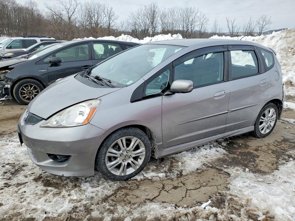 HONDA FIT 2009 with VIN JHMGE88419C000699 - Photo from auction