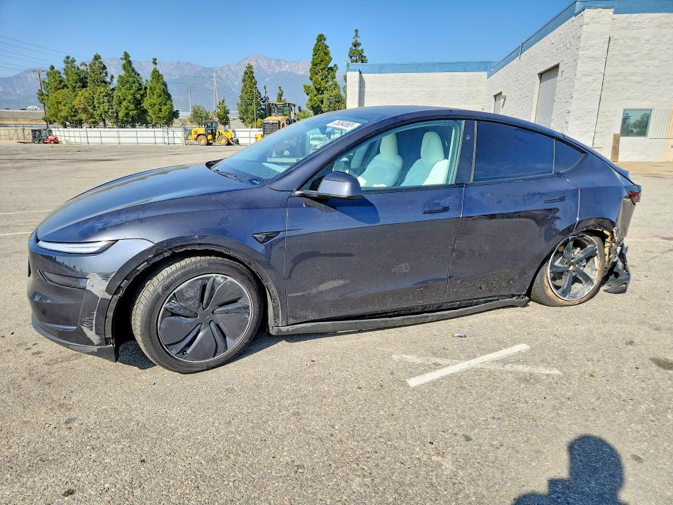 TESLA MODEL Y 2026 with VIN 7SAYGDED1TF387779 - Photo from auction