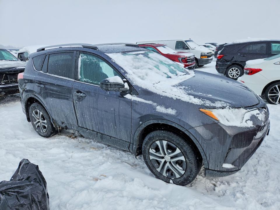 Photo 4 from auction – 2018 TOYOTA RAV4 LE with VIN 2T3BFREV6JW820113