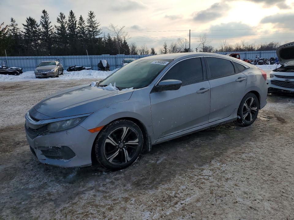 HONDA CIVIC LX 2018 with VIN 2HGFC2F58JH037084 - Photo from auction
