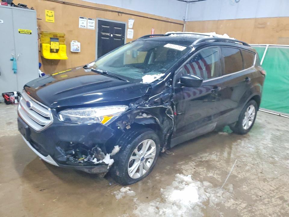 FORD ESCAPE SE 2018 with VIN 1FMCU9GD9JUD32720 - Photo from auction