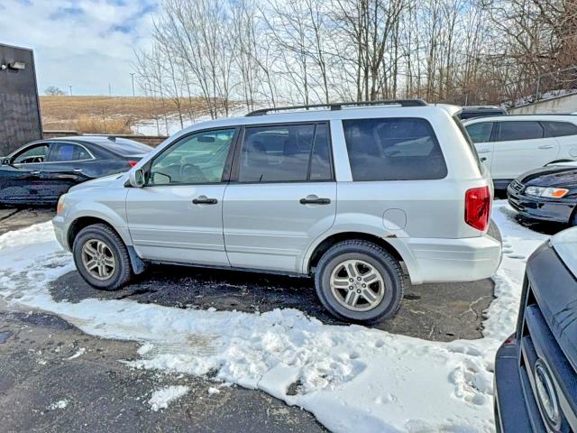 Photo 12 from auction – 2005 HONDA PILOT with VIN 2HKYF18515H516000