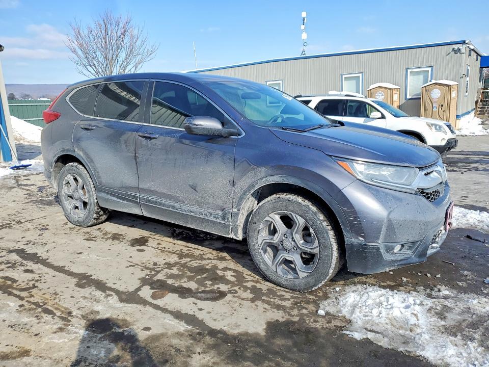 Photo 4 from auction – 2018 HONDA CR-V with VIN 7FARW2H56JE103870