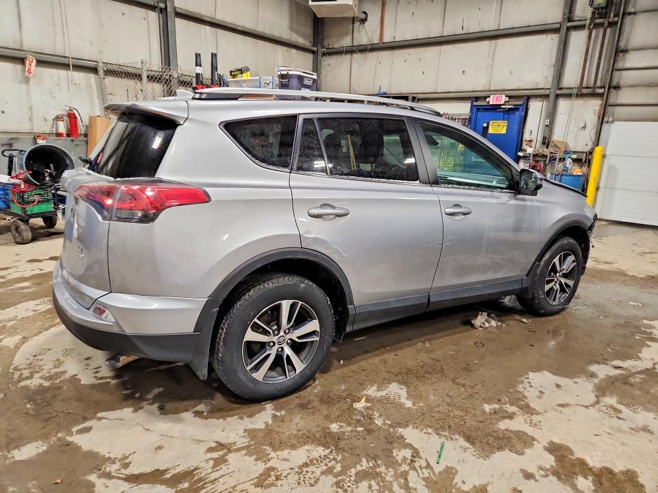 Photo 3 from auction – 2018 TOYOTA RAV4 LE with VIN 2T3BFREV7JW728007