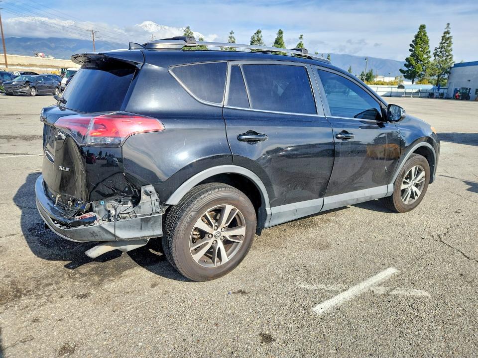 Photo 3 from auction – 2018 TOYOTA RAV4 with VIN 2T3WFREV3JW438350