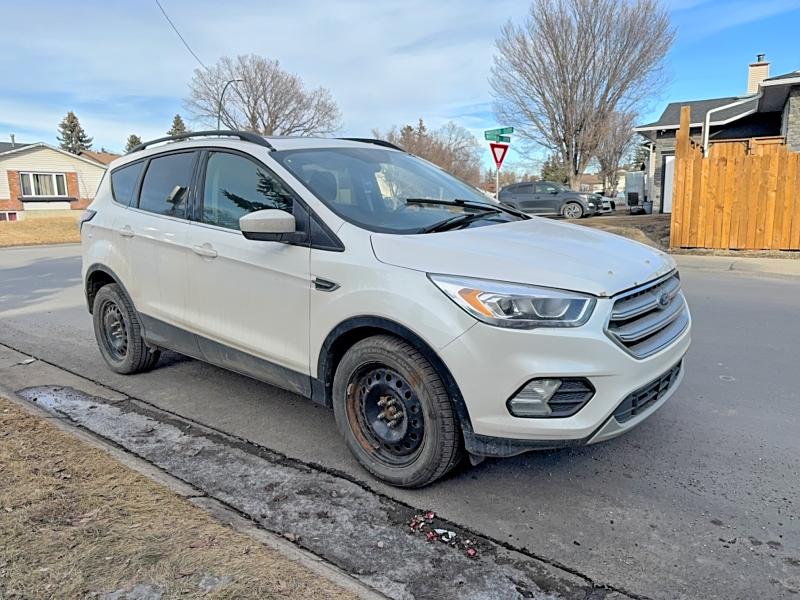 FORD ESCAPE 2017 with VIN 1FMCU9G98HUD62801 - Photo from auction