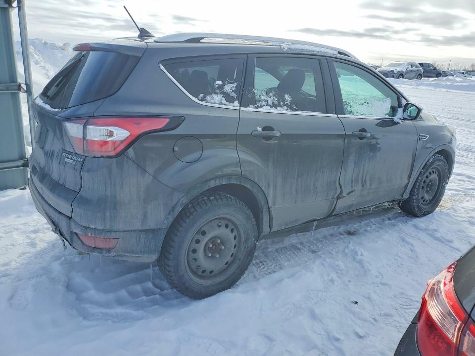 Photo 3 from auction – 2018 FORD ESCAPE with VIN 1FMCU9J90JUA38143