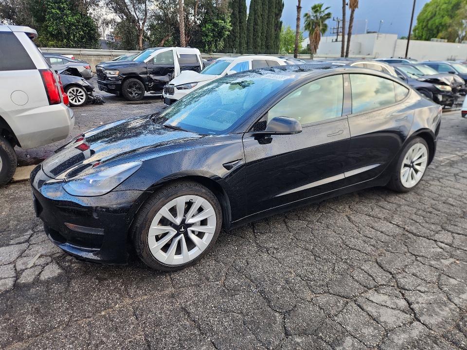 TESLA MODEL 3 2022 with VIN 5YJ3E1EA8NF288896 - Photo from auction
