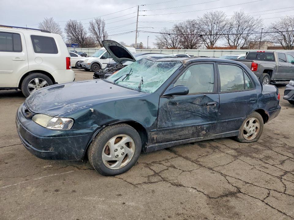 TOYOTA COROLLA 1999 with VIN 2T1BR12E2XC242639 - Photo from auction
