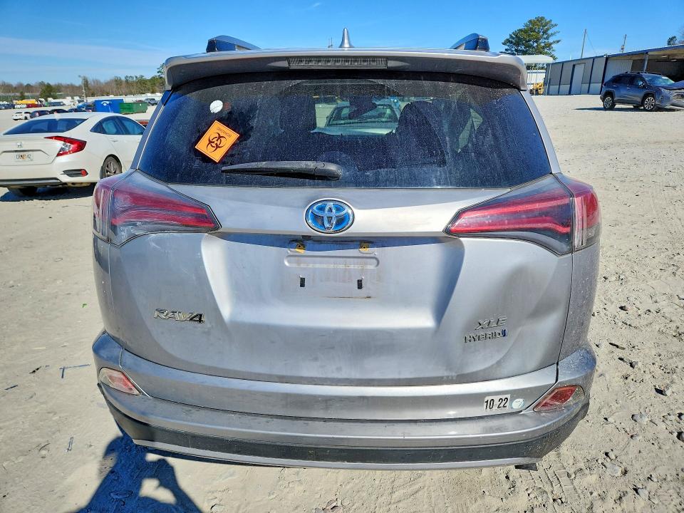 Photo 6 from auction – 2018 TOYOTA RAV4 HV LE with VIN JTMRJREV3JD175348