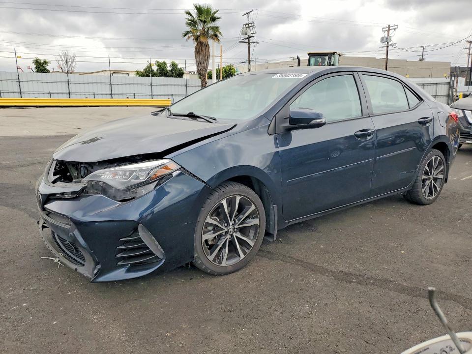 TOYOTA COROLLA L 2017 with VIN 5YFBURHE3HP702204 - Photo from auction