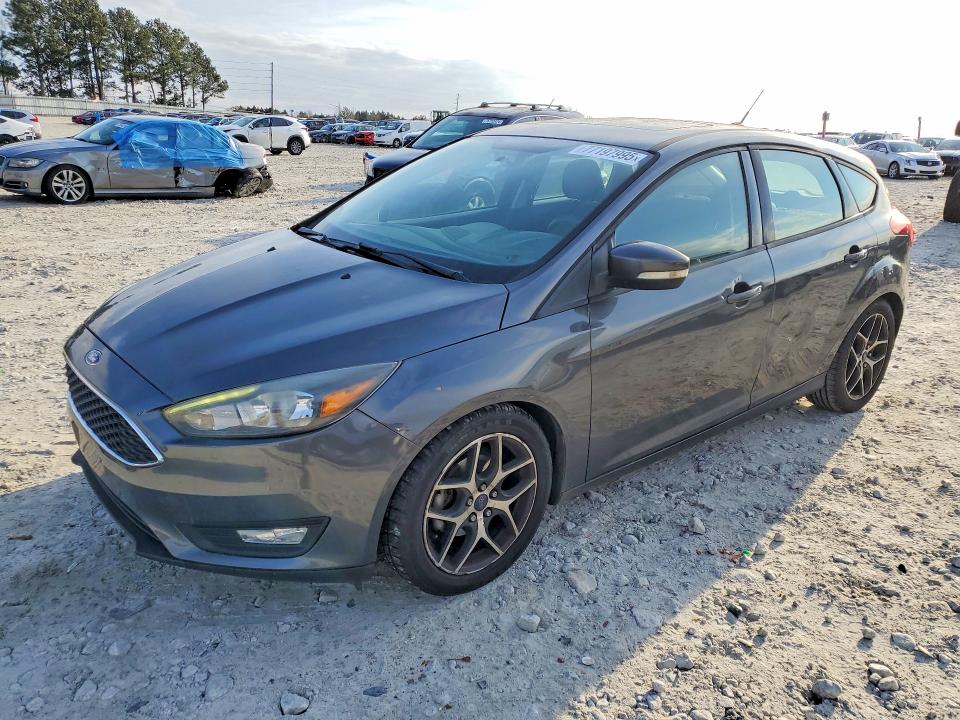 FORD FOCUS 2017 with VIN 1FADP3M2XHL311767 - Photo from auction