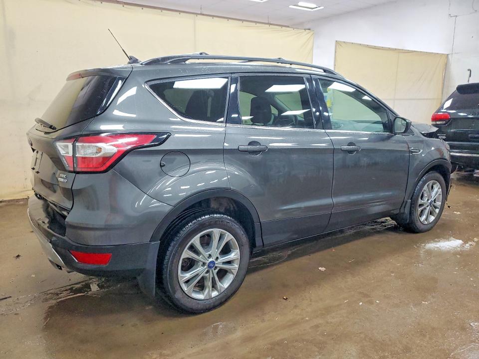 Photo 3 from auction – 2018 FORD ESCAPE with VIN 1FMCU9HD6JUC96810