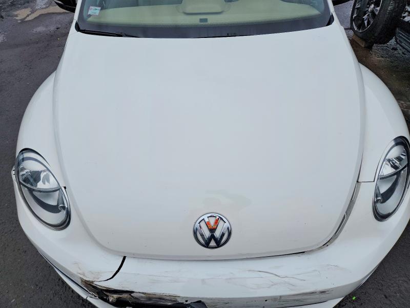 Photo 11 from auction – 2014 VOLKSWAGEN BEETLE TUR with VIN 3VW8S7ATXEM803687