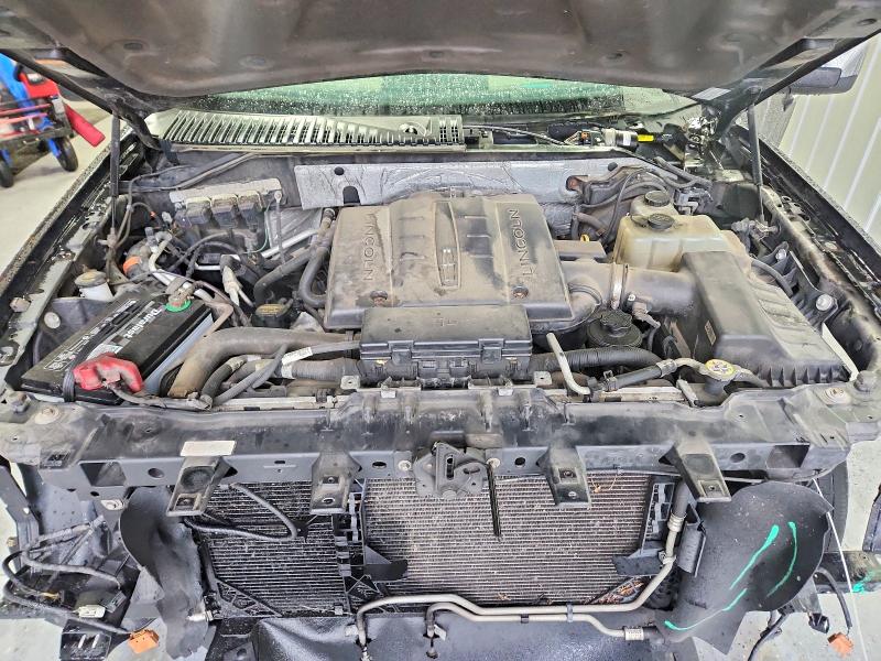 Photo 11 from auction – 2014 LINCOLN NAVIGATOR with VIN 5LMJJ2J59EEL00582