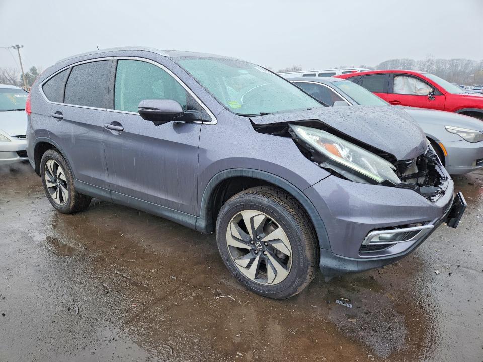 Photo 4 from auction – 2016 HONDA CR-V with VIN 5J6RM4H9XGL033693