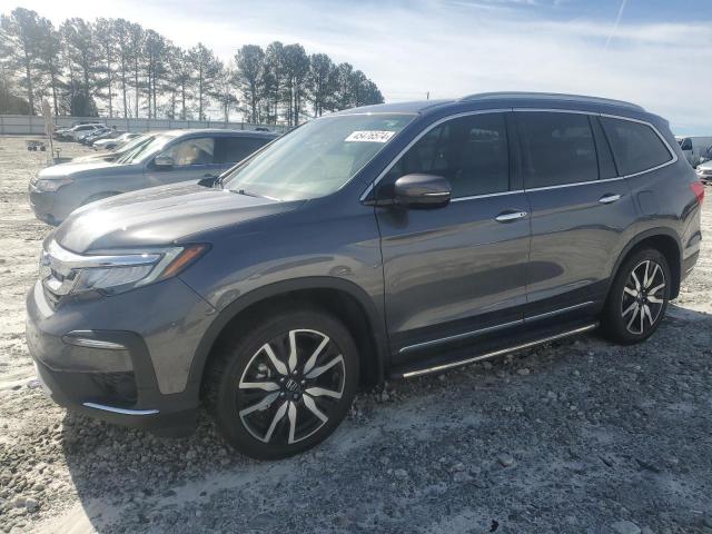 HONDA PILOT TOUR 2019 with VIN 5FNYF5H65KB043616 - Photo from auction
