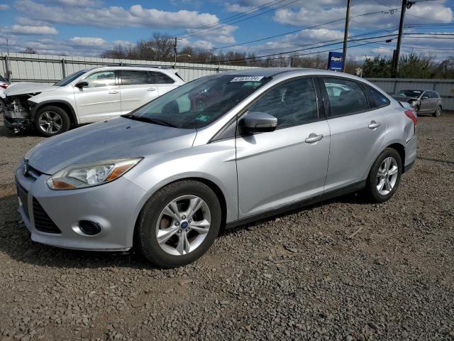 FORD FOCUS SE 2013 with VIN 1FADP3F24DL338132 - Photo from auction