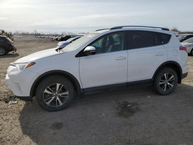 TOYOTA RAV4 LE 2018 with VIN 2T3BFREV4JW749395 - Photo from auction