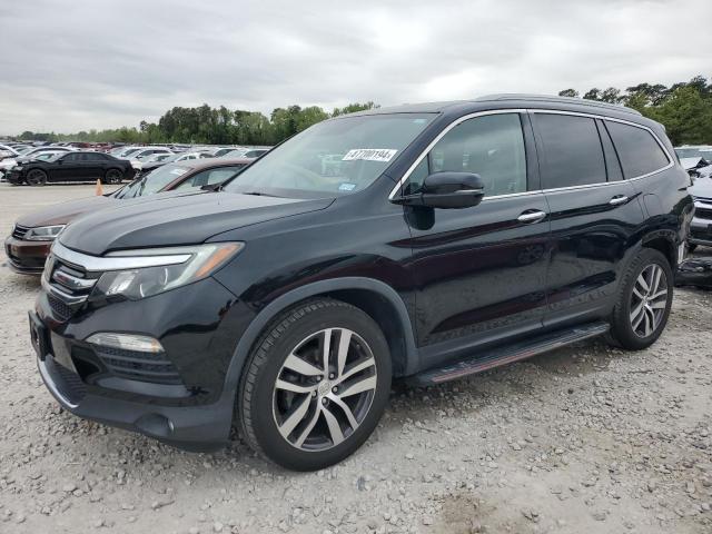 HONDA PILOT TOUR 2017 with VIN 5FNYF5H97HB007025 - Photo from auction