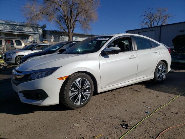 HONDA CIVIC EX 2018 with VIN 2HGFC1F35JH643435 - Photo from auction
