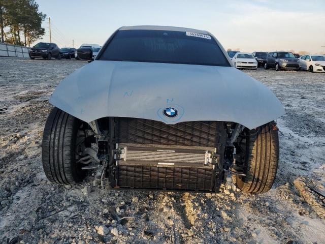 Photo 5 from auction – 2023 BMW 330I with VIN 3MW69FF01P8D43908