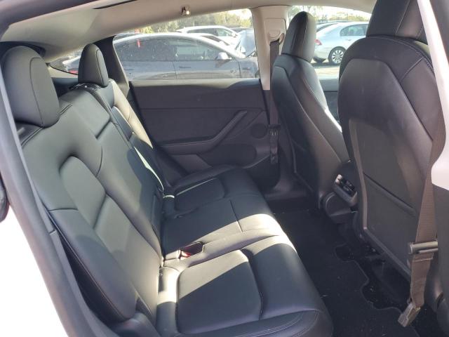 Photo 11 from auction – 2022 TESLA MODEL Y with VIN 7SAYGAEE6NF311940