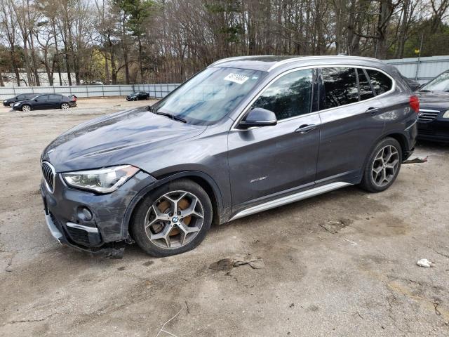 BMW X1 XDRIVE2 2017 with VIN WBXHT3Z35H4A54025 - Photo from auction