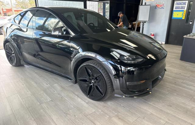 TESLA MODEL Y 2023 with VIN 7SAYGDEEXPF626051 - Photo from auction