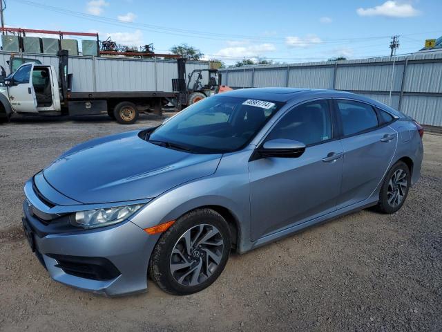 HONDA CIVIC EX 2018 with VIN 2HGFC2F74JH570843 - Photo from auction