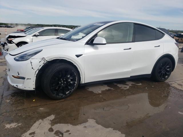 TESLA MODEL Y 2023 with VIN 7SAYGAEE2PF585557 - Photo from auction