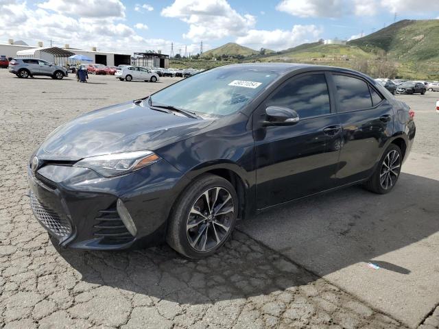 TOYOTA COROLLA L 2018 with VIN 5YFBURHE4JP774759 - Photo from auction