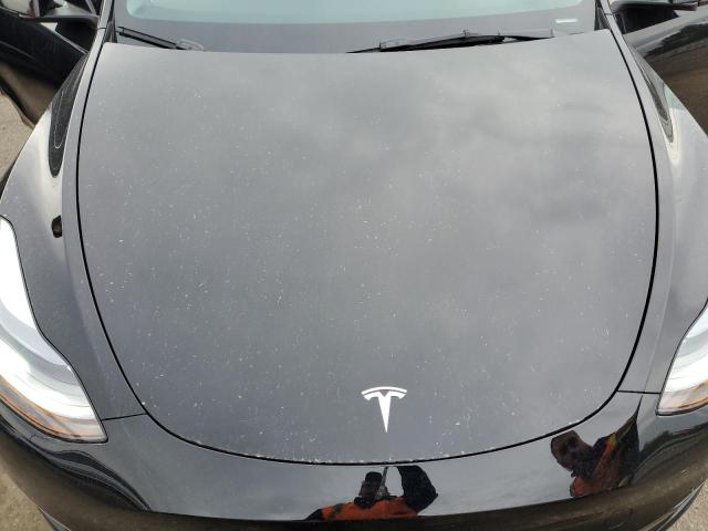 Photo 11 from auction – 2023 TESLA MODEL Y with VIN 7SAYGDEE8PF875674