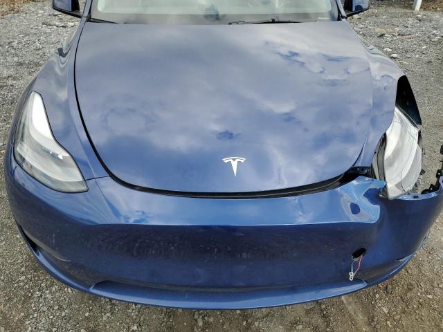 Photo 11 from auction – 2023 TESLA MODEL Y with VIN 7SAYGDEE6PF704292