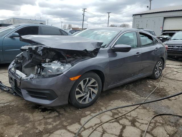 Photo 1 from auction – 2018 HONDA CIVIC EX with VIN 19XFC2F72JE025900