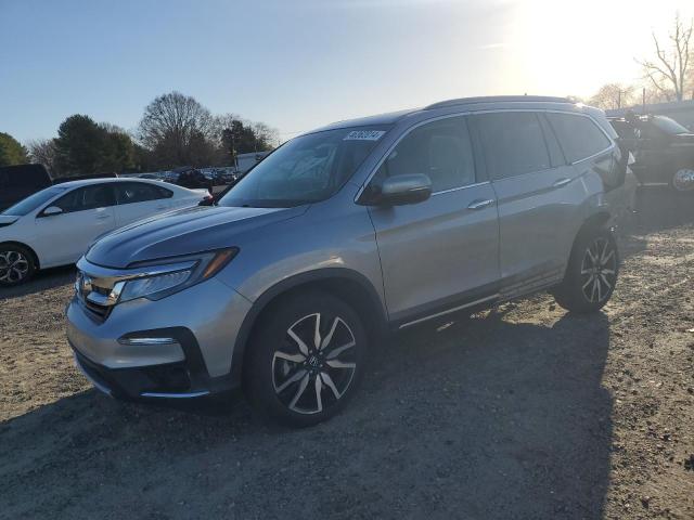 Photo 1 from auction – 2020 HONDA PILOT TOUR with VIN 5FNYF5H65LB010911