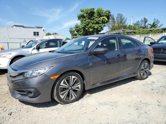 HONDA CIVIC EX 2018 with VIN JHMFC1F38JX008718 - Photo from auction