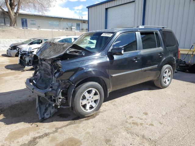 HONDA PILOT TOUR 2010 with VIN 5FNYF3H80AB015467 - Photo from auction