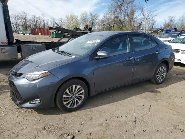 TOYOTA COROLLA L 2017 with VIN 5YFBURHE6HP601075 - Photo from auction