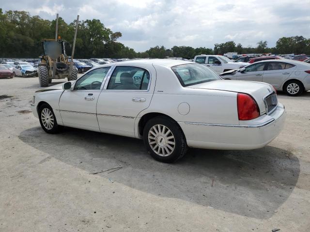 Photo 2 from auction – 2004 LINCOLN TOWN CAR U with VIN 1LNHM83W44Y669106