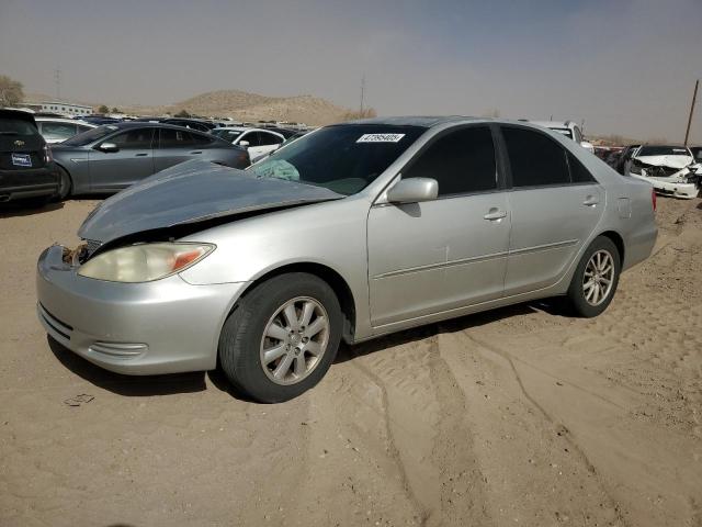 TOYOTA CAMRY LE 2002 with VIN JTDBF30K120021811 - Photo from auction