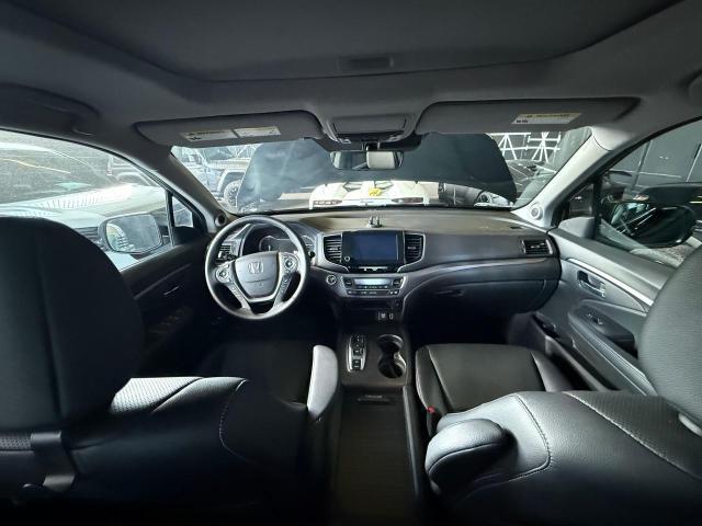 Photo 9 from auction – 2023 HONDA RIDGELINE with VIN 5FPYK3F54PB034057