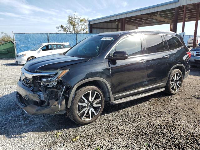 HONDA PILOT TOUR 2019 with VIN 5FNYF5H97KB007291 - Photo from auction
