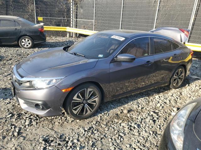 HONDA CIVIC EX 2018 with VIN JHMFC1F33JX010358 - Photo from auction
